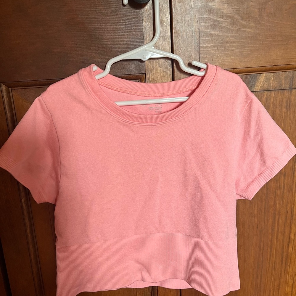 Offline by Arie salmon, pink cropped tee. New without tags. Size XS